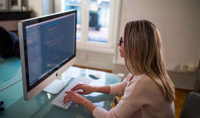Woman coding on a computer