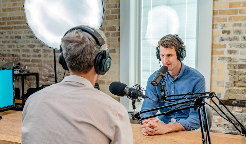 Two men recording a podcast